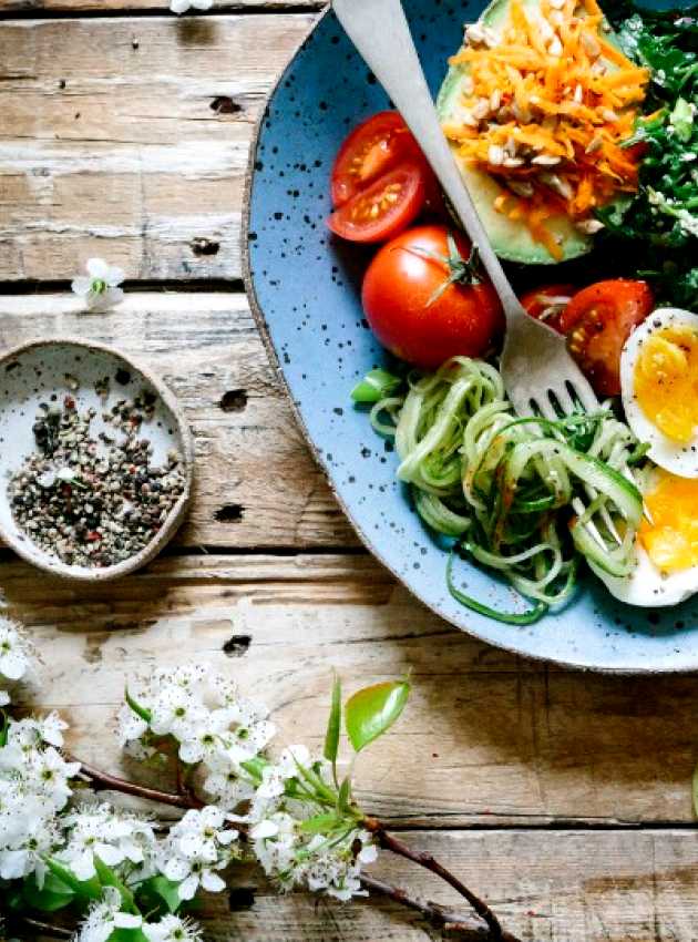 bowl with tomatoes, egg and greens