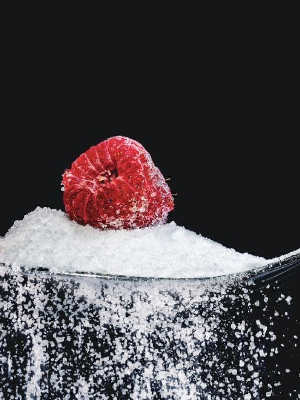 refined sugar with a raspberry