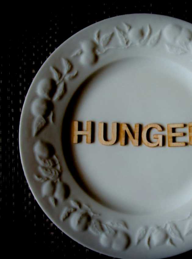 plate with fruits symbols with ''HUNGER'' inscription