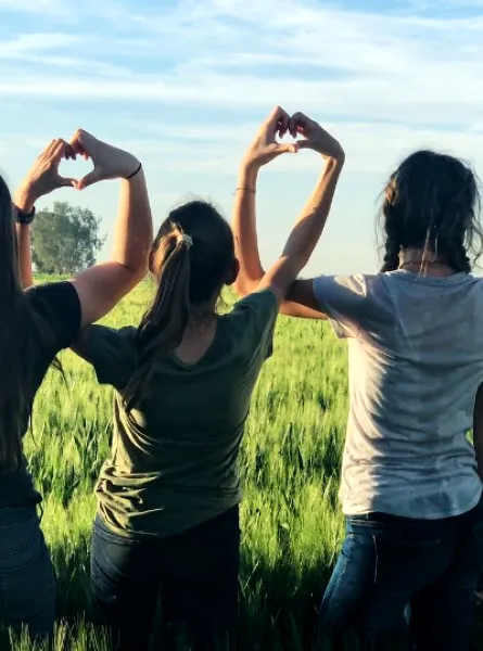 4 teenage girls in a field