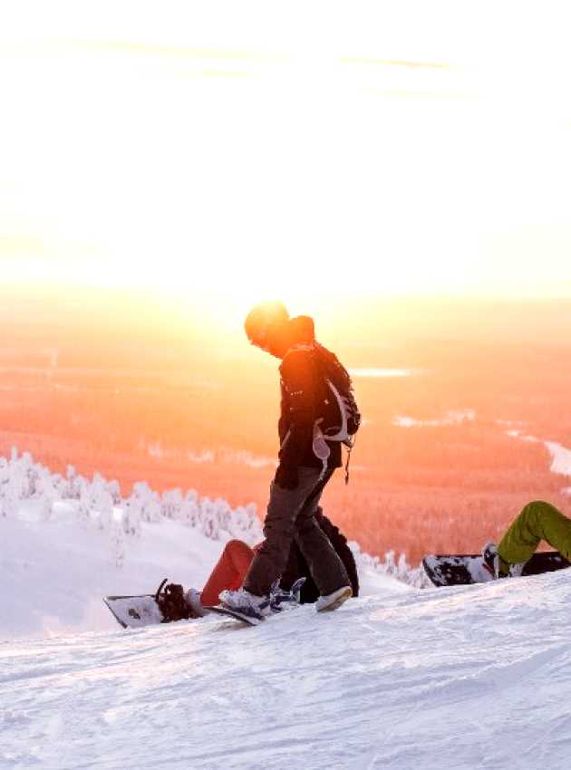 adults skiing in the middle of winter on a mountain