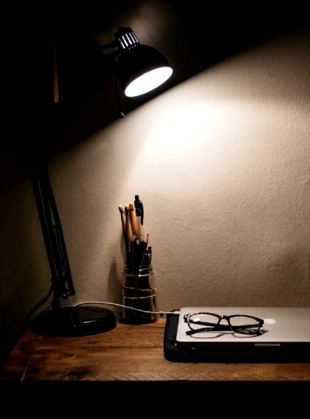 work desk illuminated by a lamp