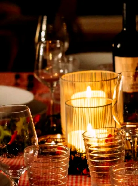 meal on the table with bottle of wine and candle