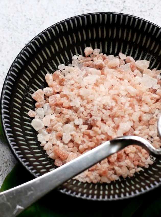 bowl of Himalayan salt with spinach on the side