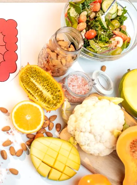 the digestive system is surrounded by fruits and vegetables