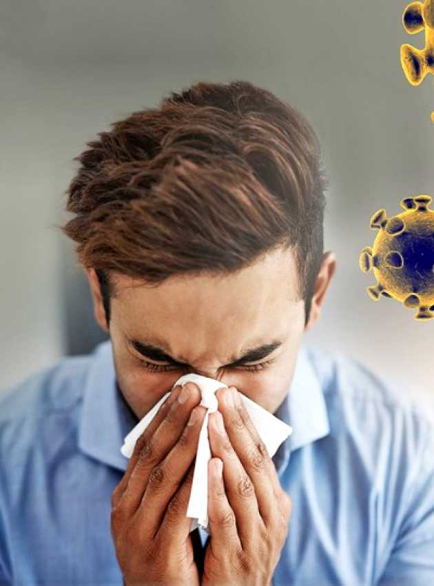 a man blowing his nose beside coronavirus