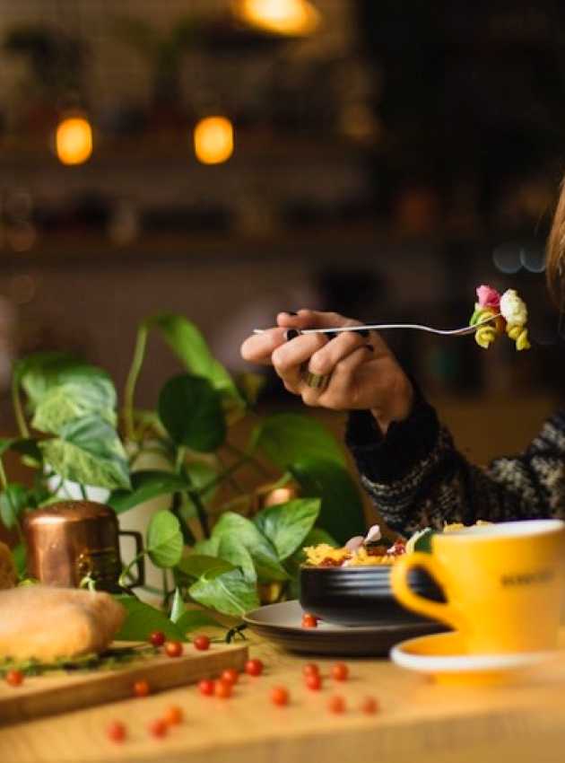 a woman eating vegetables