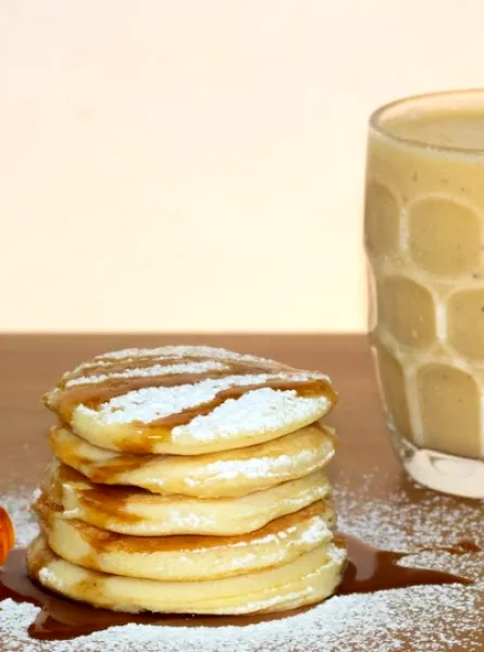 Pancakes with maple syrup and a latte