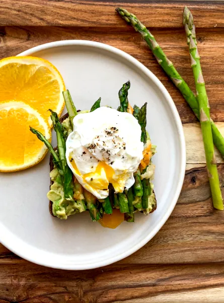 Plate with orange and benedict egg
